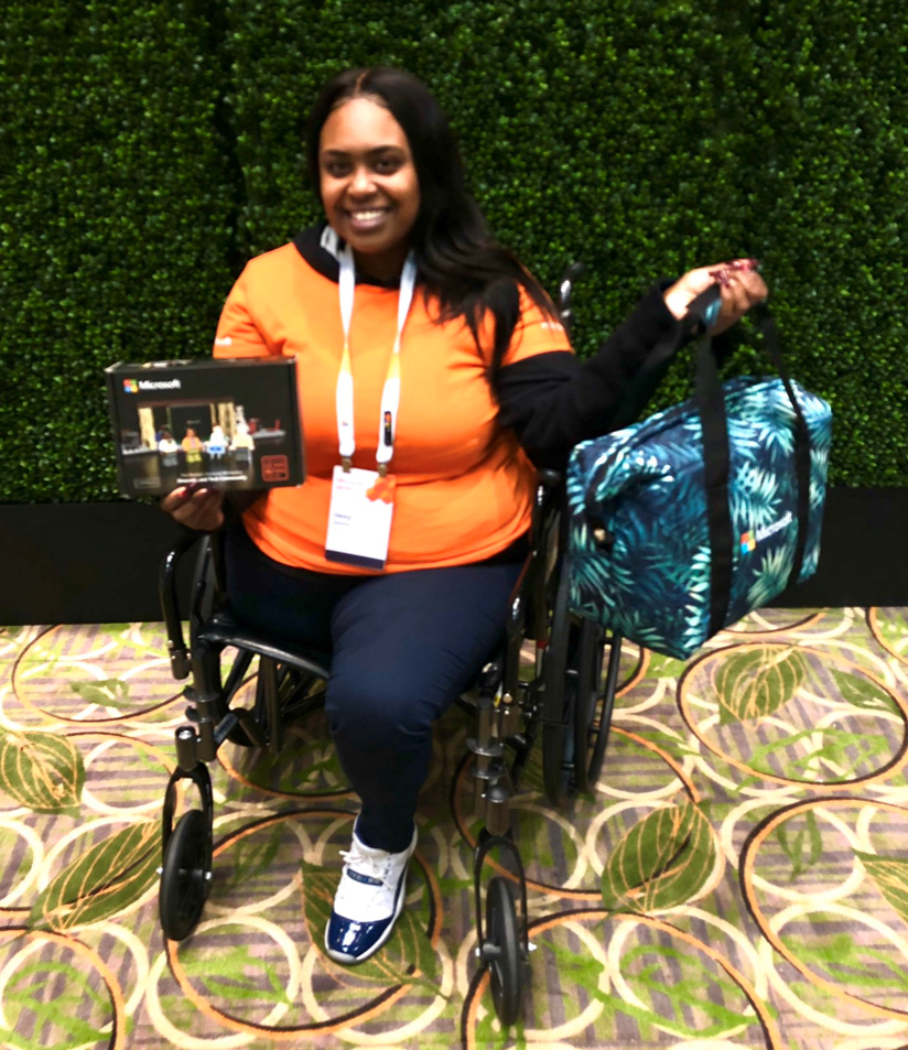 When we can all play, everyone wins! Here's an attendee with her Humans of IT prizes!