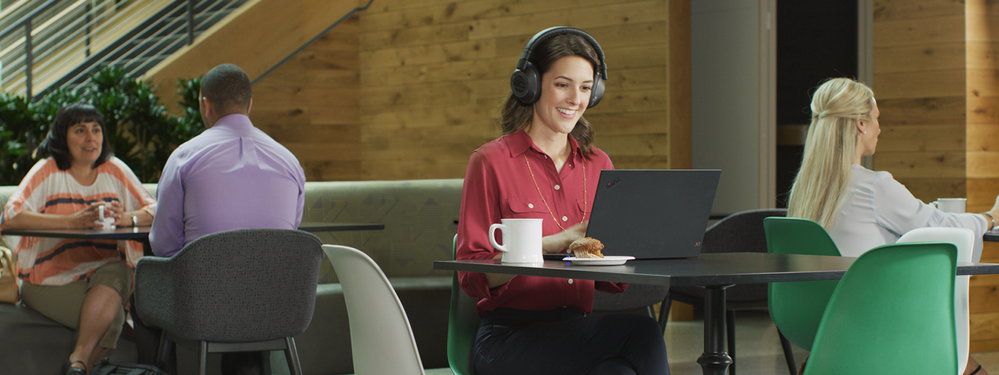 thumbnail image 9 captioned Person sitting in an open space environment wearing a Teams-certified headset while attending an online meeting