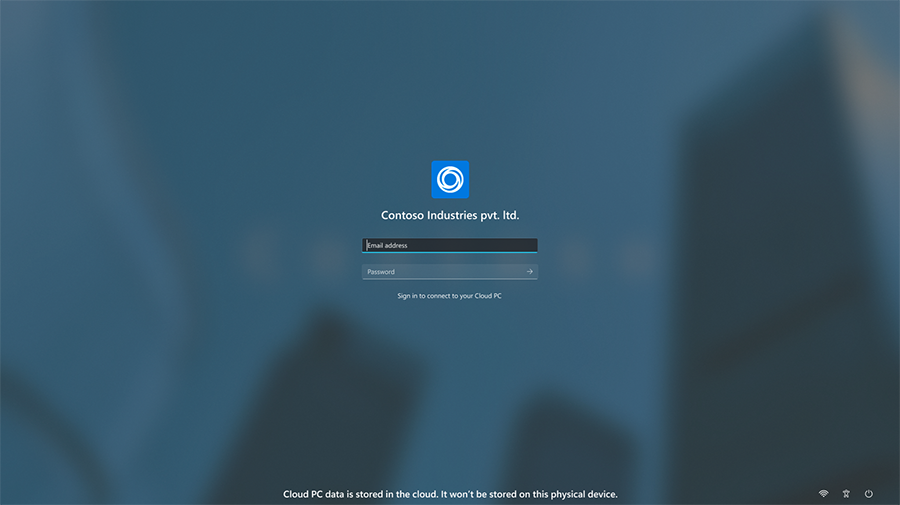 Screenshot of the customized login screen with the Contoso logo, name, and wallpaper.