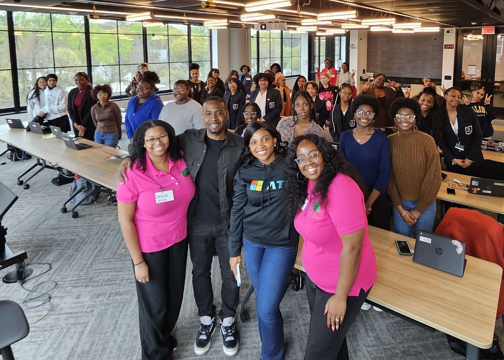 An image of Kara Branch, Darrell Booker, Regina Asuquo and Anjie Adeyemo with a group at the Black Girls Do Engineer Corporation AI Workshop in Atlanta.