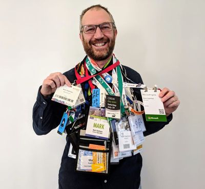 Mark Kashman showing all his conference badges from over the years. Send us your creative display of your conference badges or SWAG to enter the SPC19 full conference pass giveaway.