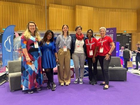 The “Women in Tech & Allies” panel – in front of the Airstream trailer within the Expo Hall.