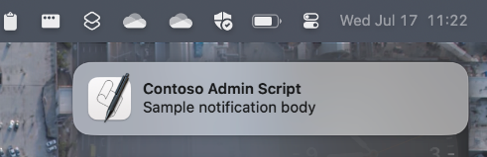 Screenshot of a sample ‘Contoso Admin script’ notification in the macOS Notification Center.
