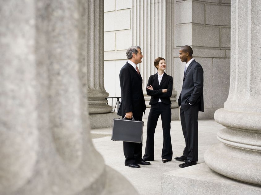 3 business colleagues standing and talking