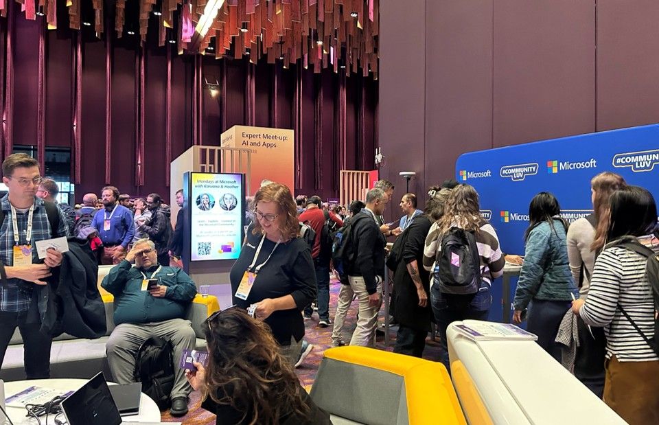 People at a conference talking with each other