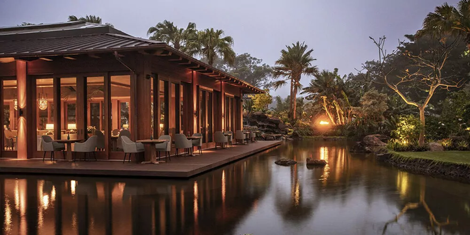 Photo of a building surrounded by water and trees at the Sensei Lānaʻi, A Four Seasons Resort