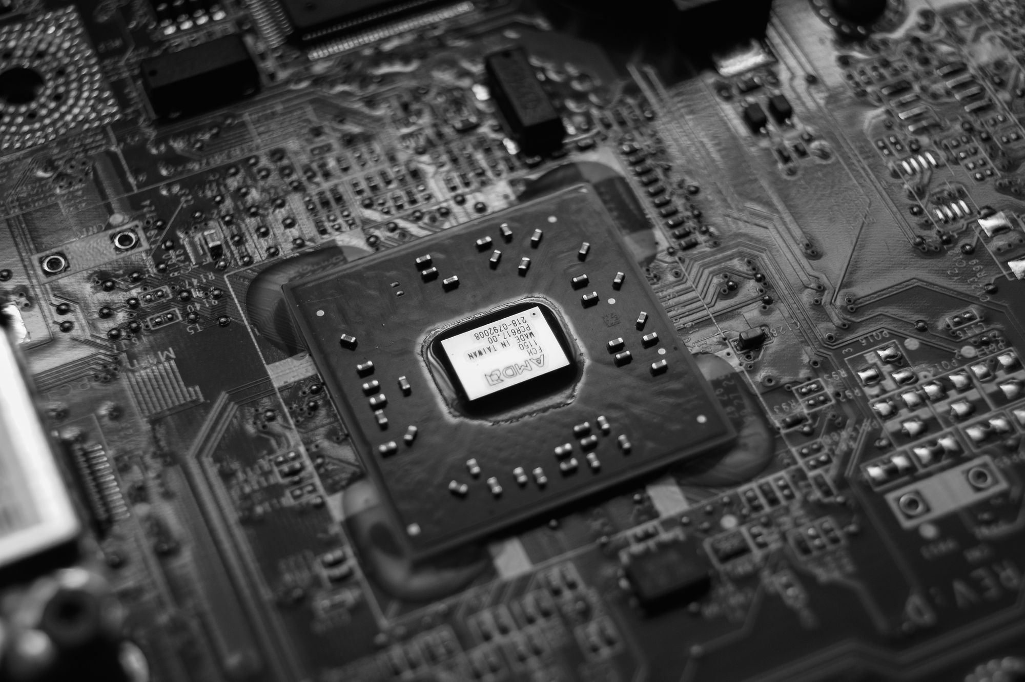Black and white photograph of a processor in a motherboard