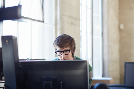 IT Pro sitting at desktop computer