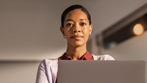 An IT administrator stares confidently at the camera