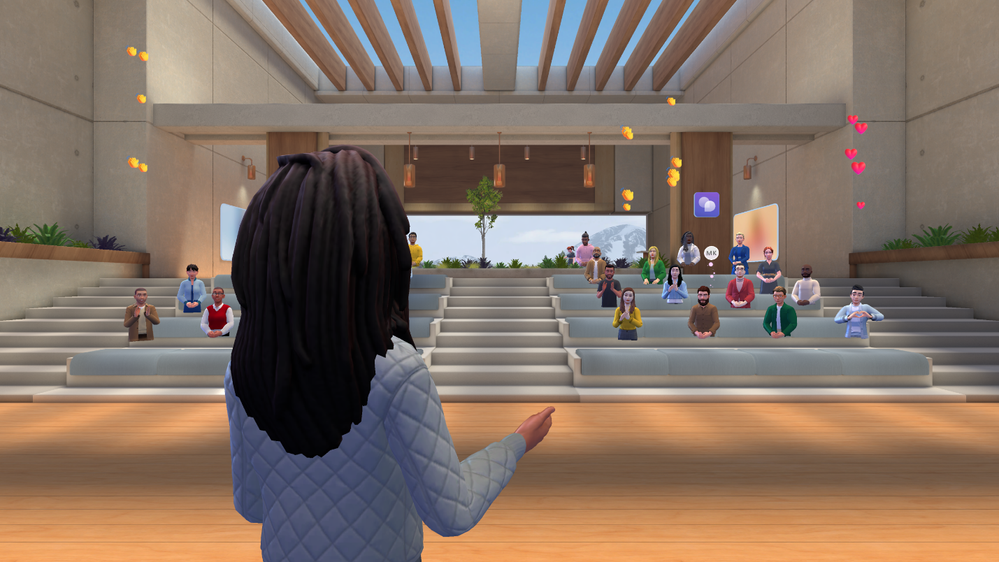 An immersive event in Teams, showing a virtual presenter from behind. The presentation is taking place in a virtual auditorium with the avatars of several attendees viewing.