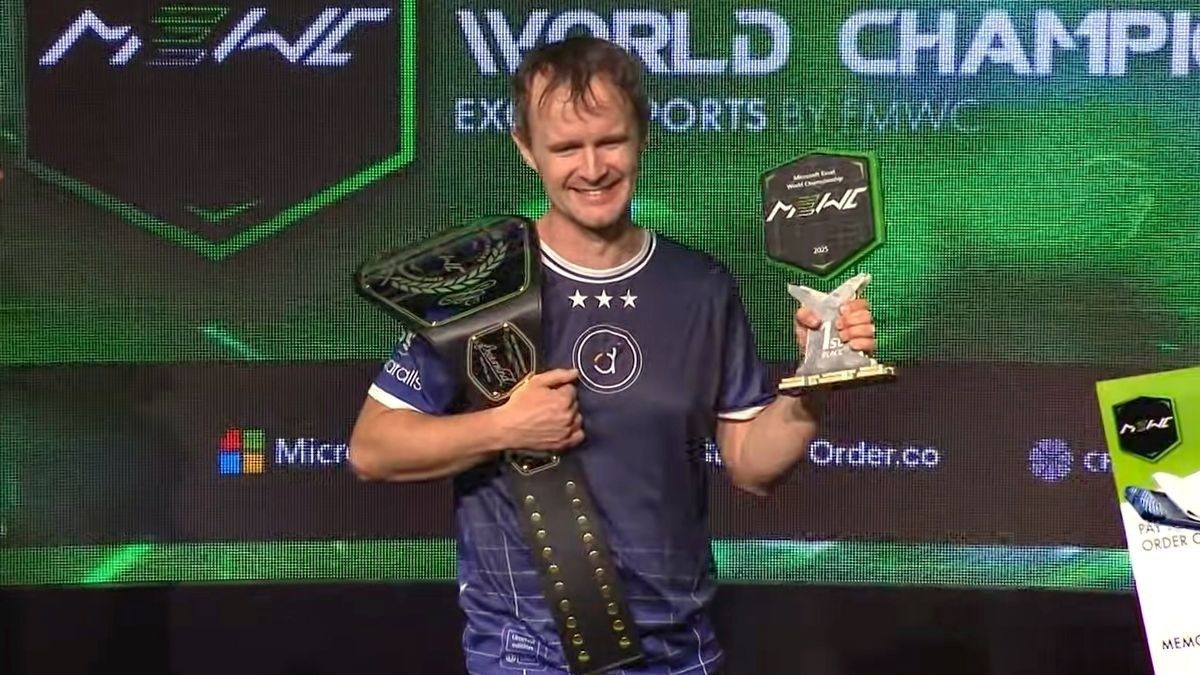 A picture of MVP Diarmuid Early winning the Microsoft Excel World Championship. He is holding a trophy and championship belt. Photo credit: MVP Giles Male