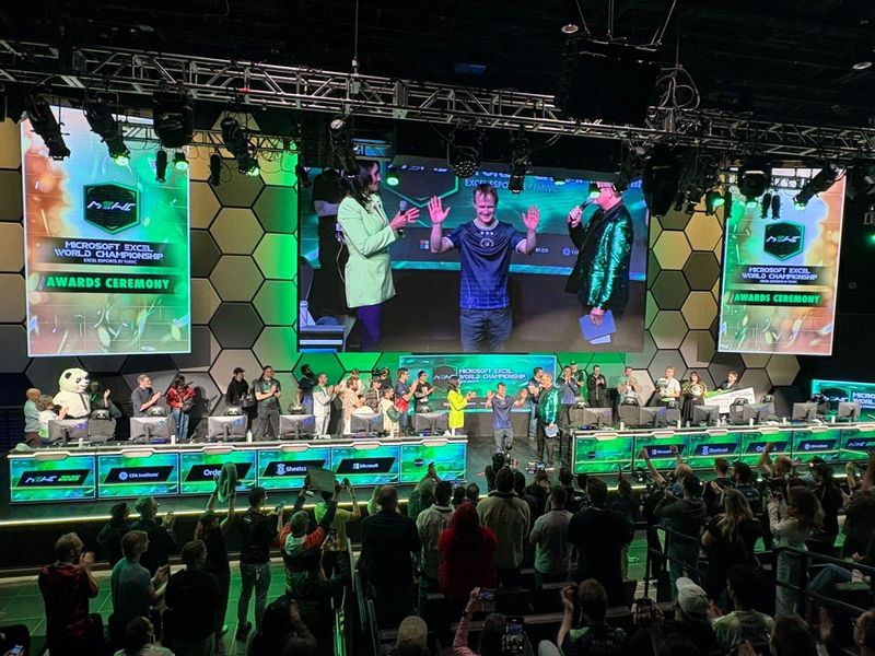 A picture of the Microsoft Excel World Championship Award Ceremony with many people on a stage.