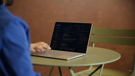 Person activating integrated privacy screen feature on Surface Laptop