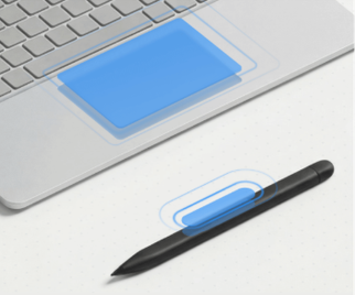 A Surface touchpad and pen with an outline depicting where haptics are located (the full touch pad and middle of the pen)