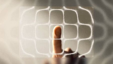A finger pressing on a screen to artistically show haptic feedback.