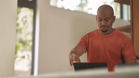 An IT professional reads updates on their computer