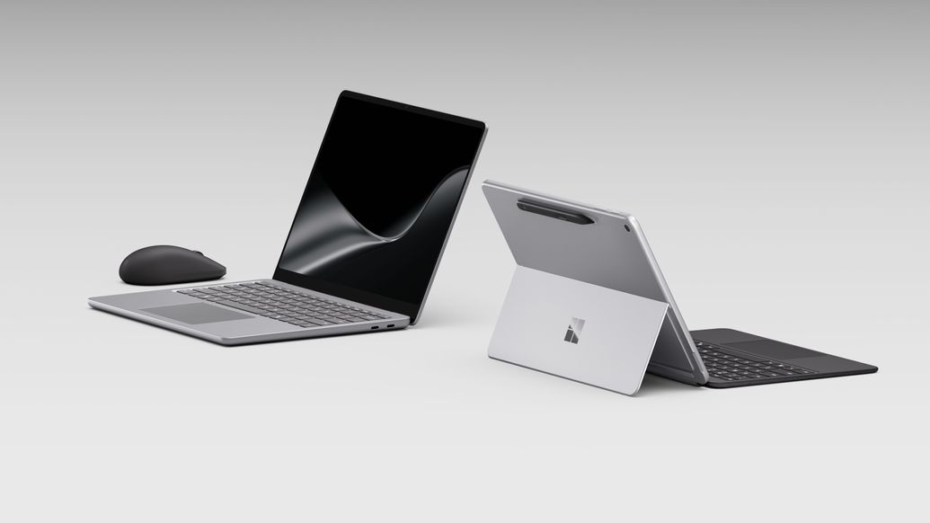 Surface Laptop facing left with a mouse next to it and a Surface Pro facing to the right with the back showing