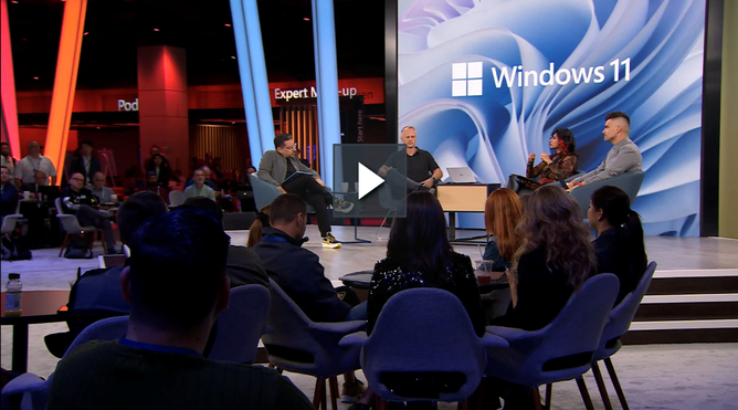 Screenshot of the Ignite session, Windows: Building what matters most for your business, showing Panos Panay having a panel-style discussion with Ramya Chitrakar, David Weston, and Scott Manchester