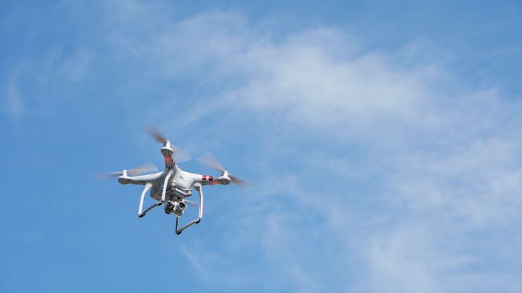 Drone flying with clear sky