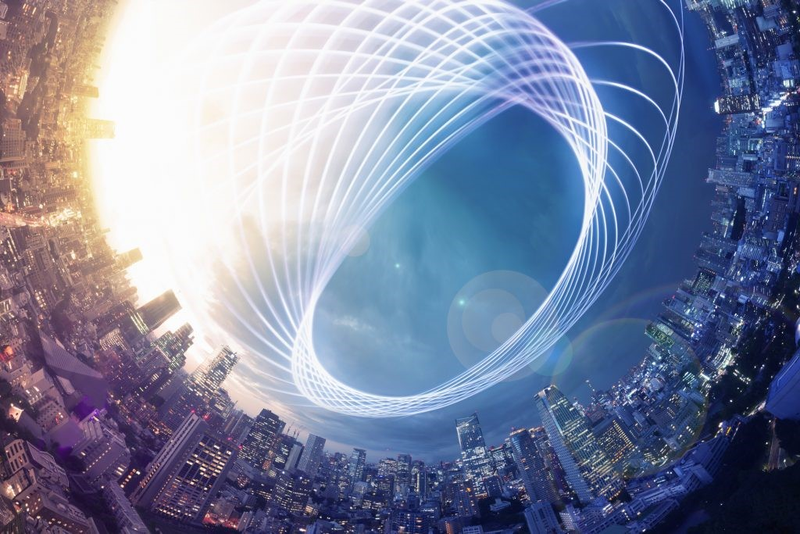 An image of a fishbowl view of a city skyline with a geometric design above the buildings.