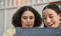 two women smiling with laptop_resized.jpg